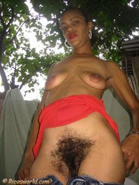 Carlota standing, showing her insane full bush